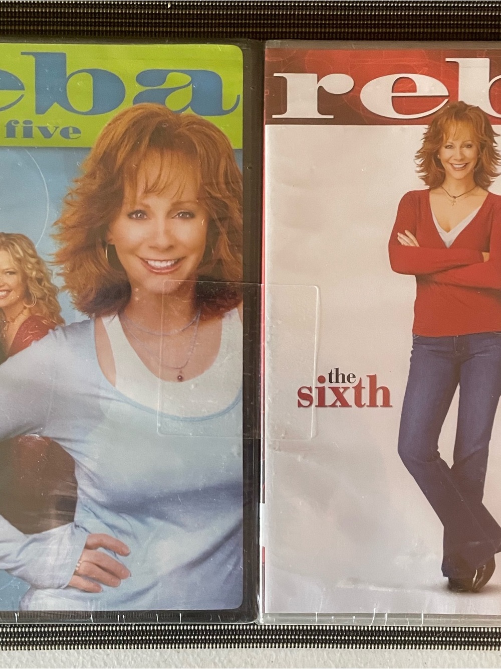 Reba DVD Set with Red and Light Blue Covers
